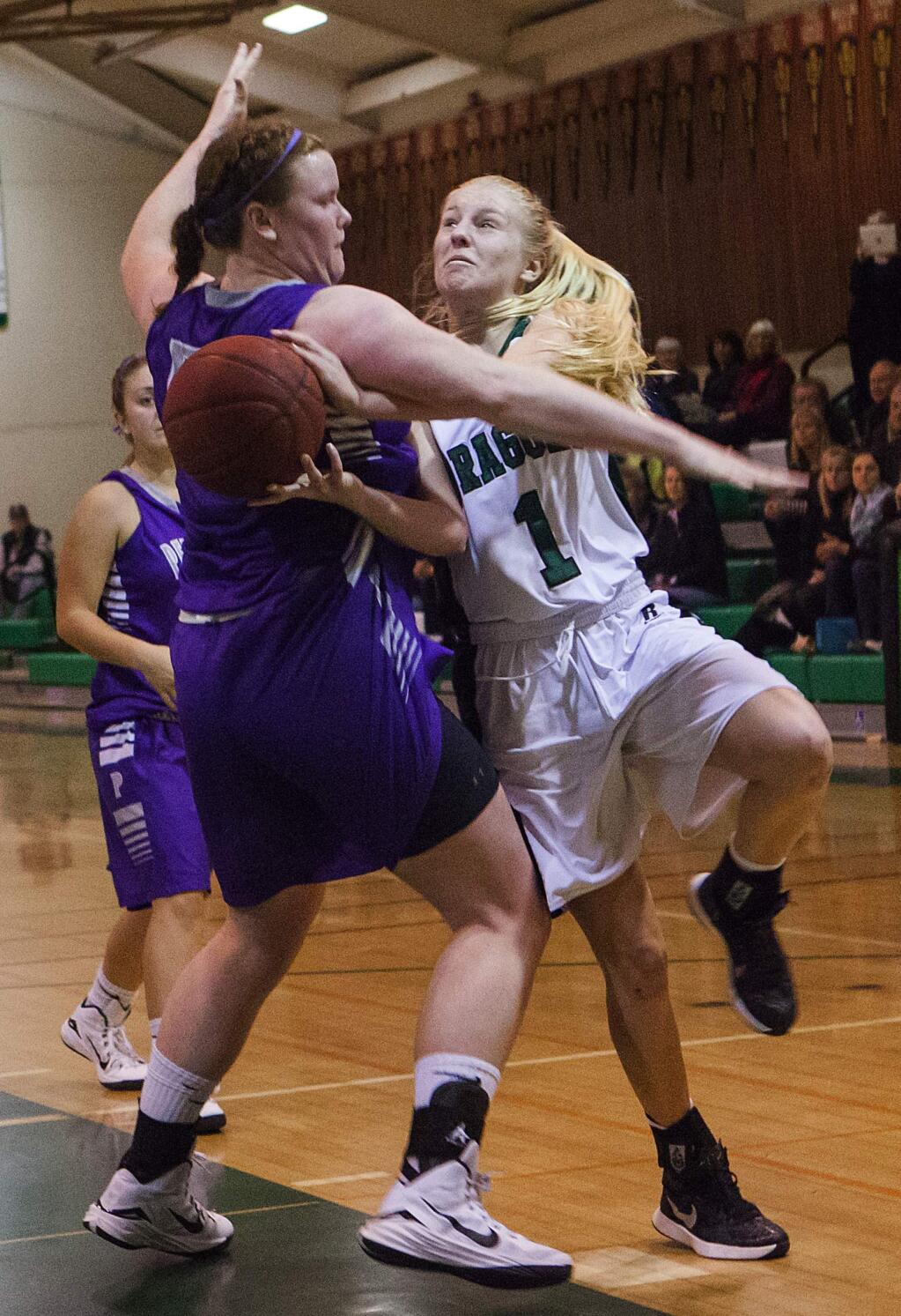 Robbi Pengelly/Index-TribuneJunior Sami Von Gober (No. 1) is fouled during the Lady Dragons' earlier SCL victory over longtime rival Petaluma Tuesday night in Pfeiffer Gym. On Tuesday, the Trojan girls avenged their Sonoma loss on their home court.