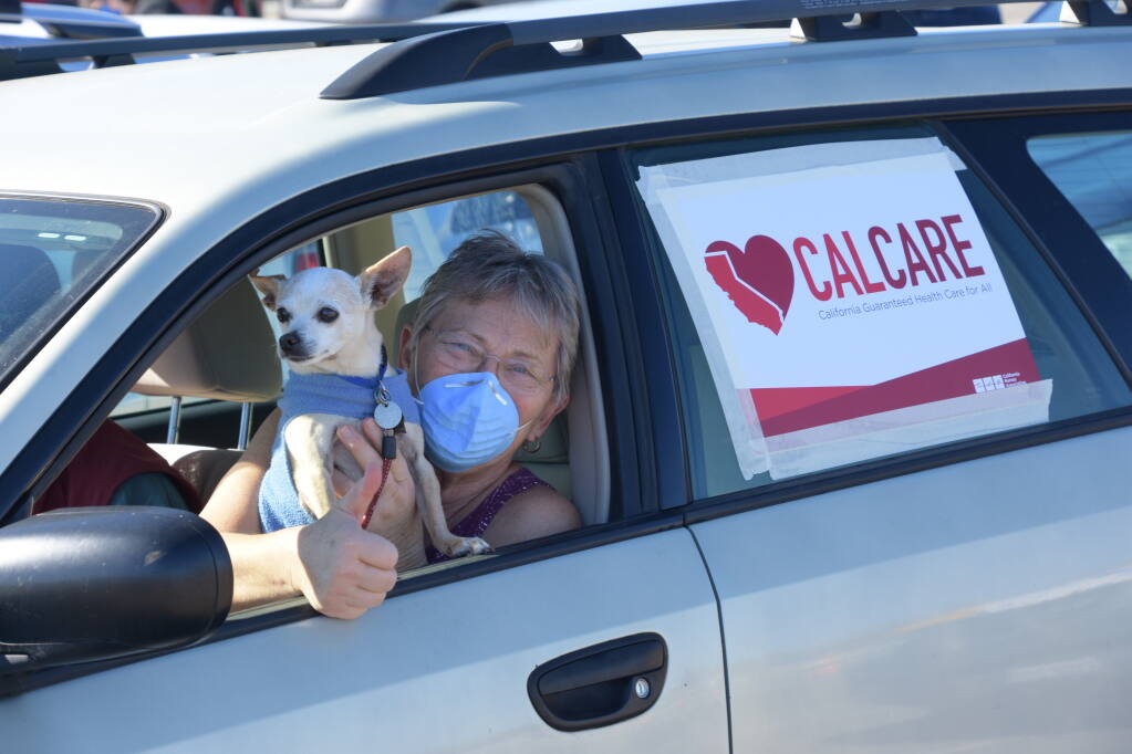 Area health workers and activists led a car caravan through downtown Petaluma Feb. 6, in partnership with similar demonstrations across the state led by California Nurses Association urging single-payer healthcare. (Photo by Karen Preuss)