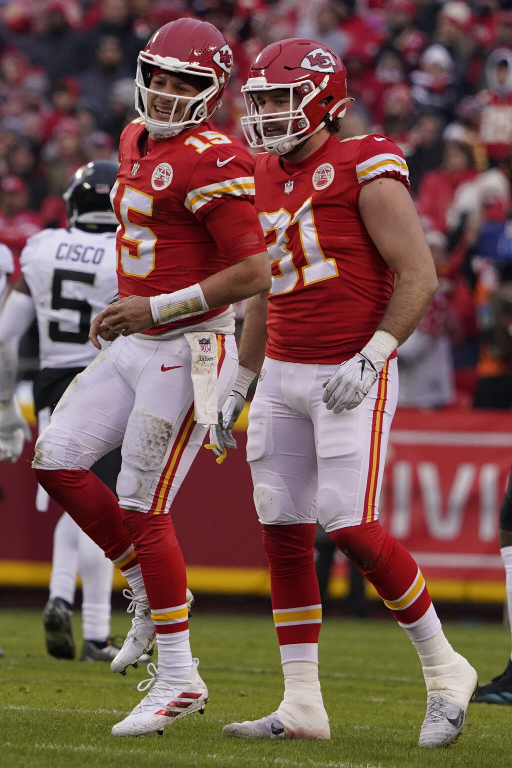 Kansas City Chiefs quarterback Patrick Mahomes (15) limps after an injury during the first half of an NFL divisional round playoff football game against the Jacksonville Jaguars, Saturday, Jan. 21, 2023, in Kansas City, Mo. (AP Photo/Ed Zurga)