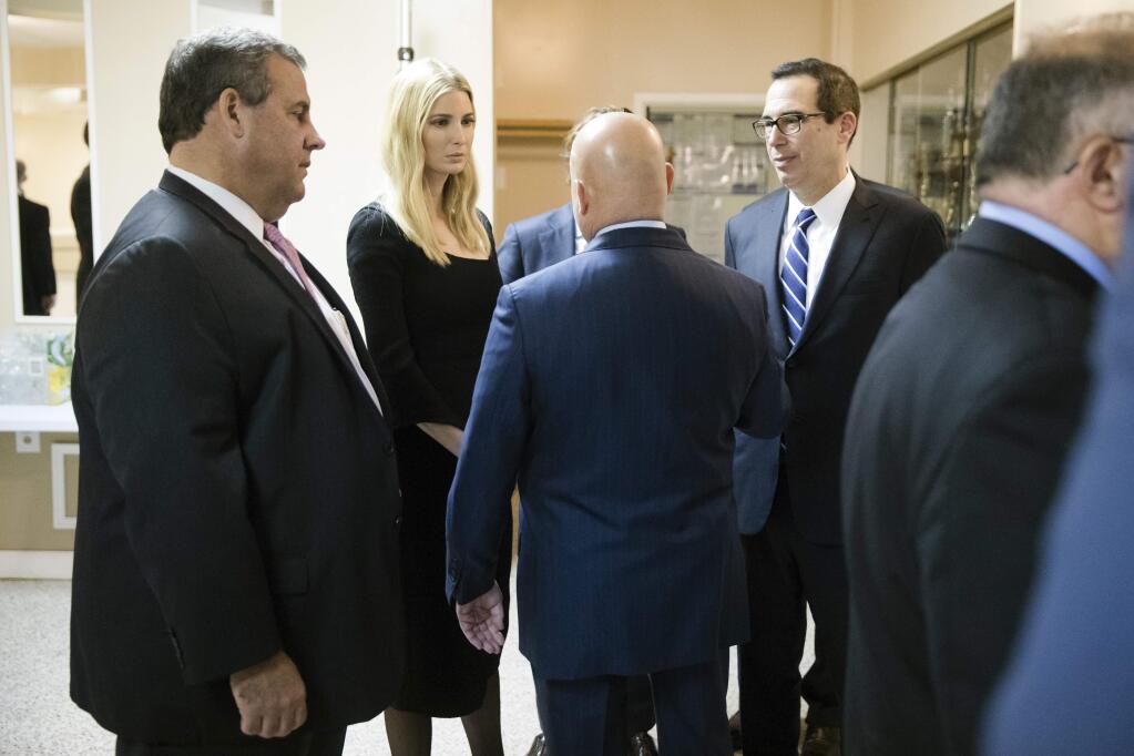 White House adviser Ivanka Trump, Treasury Secretary Steve Mnuchin, right, speaks with Tom MacArthur, R-N.J., center, as Gov. Chris Christie looks on, in Bayville, N.J., Monday, Nov. 13, 2017. Ivanka Trump is putting it all on the line for the Republican tax overhaul. Signaling a new stage in her Washington career, the senior White House adviser recently hit the road to sell the plans that have drawn Democratic criticism and spurred some GOP conflict. (AP Photo/Matt Rourke)