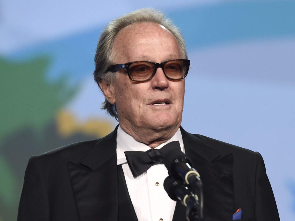 FILE - In this Jan. 2, 2018 file photo, Peter Fonda presents the Desert Palm achievement award at the 29th annual Palm Springs International Film Festival in Palm Springs, Calif. Fonda has apologized for a late-night Twitter rant that said 12-year-old Barron Trump should be ripped from ‚Äúhis mother‚Äôs arms and put in a cage with pedophiles.‚Äù The all-capitals tweet early Wednesday went on to call President Donald Trump an expletive. Fonda later deleted the tweet and drew sharp rebukes from first lady Melania Trump and Donald Trump Jr. (Photo by Chris Pizzello/Invision/AP, File)