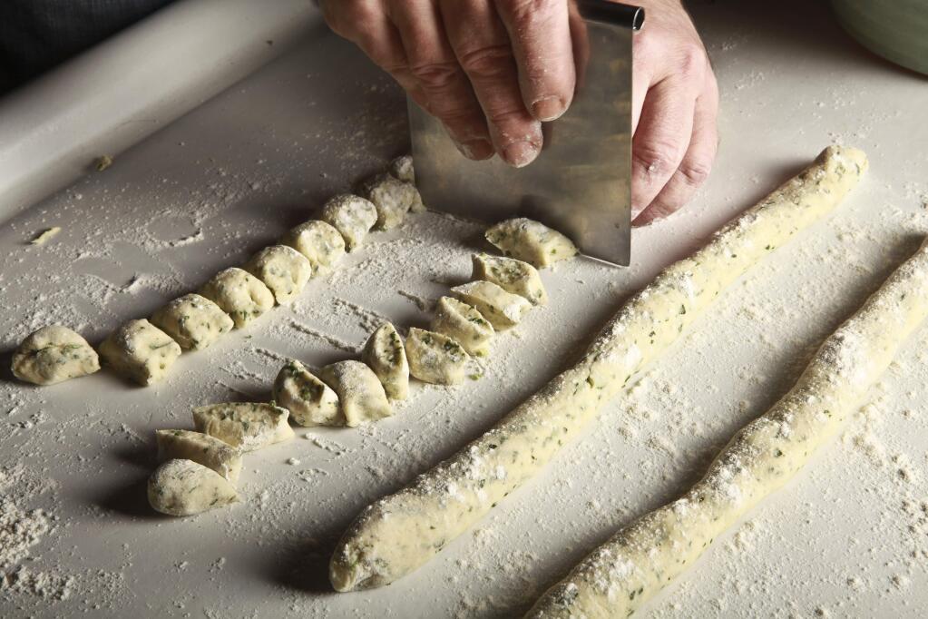 Homemade potato gnocchi is prepared. (Fred R. Conrad/The New York Times)