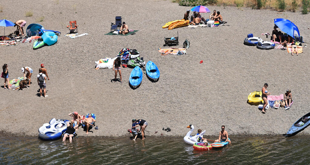 The Russian River near Guerneville is packed, Saturday, July 10, 2021 as people attempt to cool off from the inland heatwave.  (Kent Porter / The Press Democrat) 2021