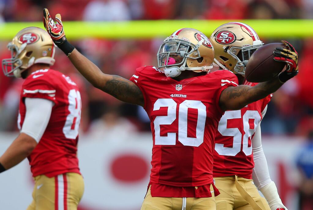 San Francisco 49ers cornerback Kenneth Acker celebrates his interception against the Baltimore Ravens during a game in Santa Clara on Sunday, October 18, 2015. (Christopher Chung / The Press Democrat)