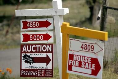 Signs points out homes for sale in the hills above Penngrove in this 2008 file photo. (John Burgess/The Press Democrat)