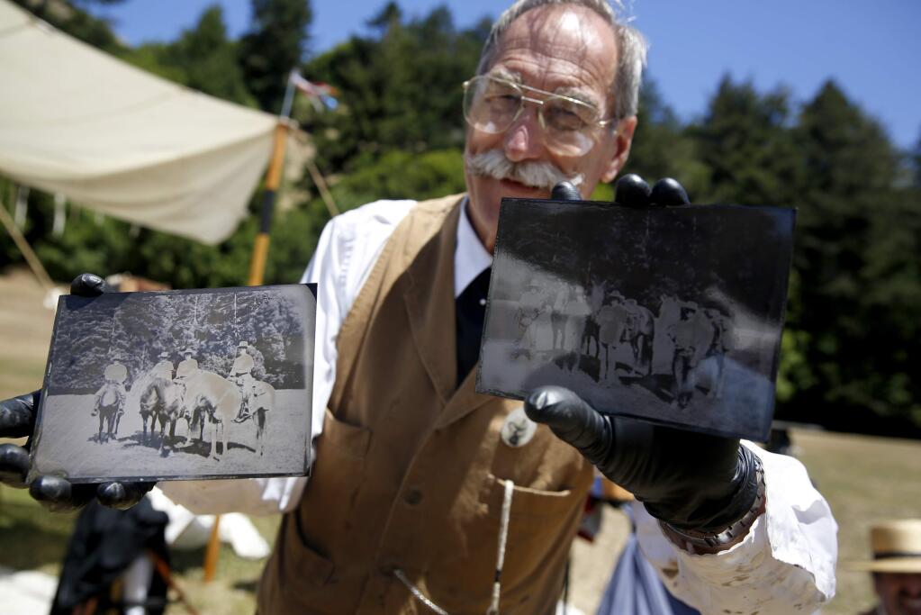 Photos by BETH SCHLANKER / The Press DemocratBruce Morton of Sonoma Tintype uses the old technology used to burn images onto metal plates, creating old-timey shots like these taken at the Civil War Days in Duncans Mills in July.
