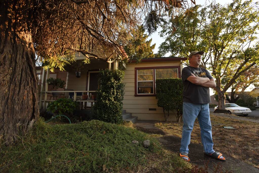 “I have a niece that lives in Petaluma if I need to leave,” said Loren Mead, 66, who is defying the mandatory evacuation order Saturday evening and will stick it out at his home with his cat Max in Healdsburg, California. October 26, 2019.(Photo: Erik Castro/for The Press Democrat)