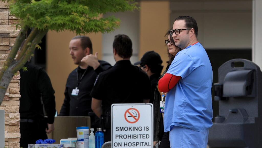 Hospital personnel evacuated the emergency room as Santa Rosa police officers were called to Memorial Hospital in Santa Rosa for a person with a machete in the ER, Friday, April 10, 2020. (Kent Porter / The Press Democrat) 2020