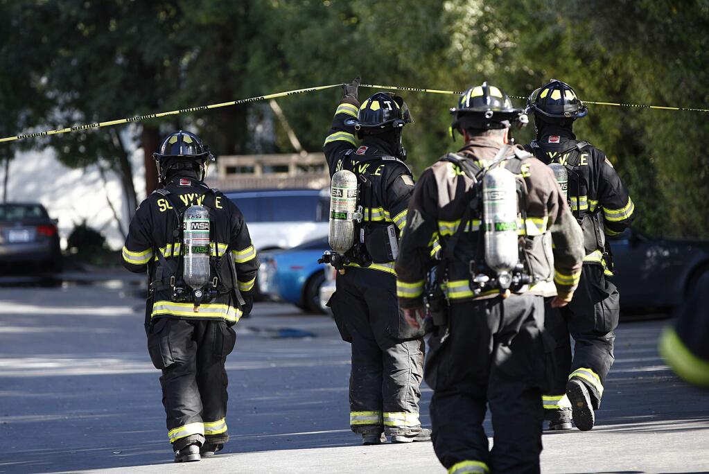 Sunnyvale Fire Department personnel respond to a call of an explosion that injured two people at Altex Technology on Sobrante Way in Sunnyvale, Calif., on Thursday, Feb. 26, 2015. Authorities say two people have been treated for minor injuries after a hazardous materials explosion inside a building in Sunnyvale, and the situation has been deemed safe. (AP Photo/San Jose Mercury News, Gary Reyes) MAGS OUT NO SALES