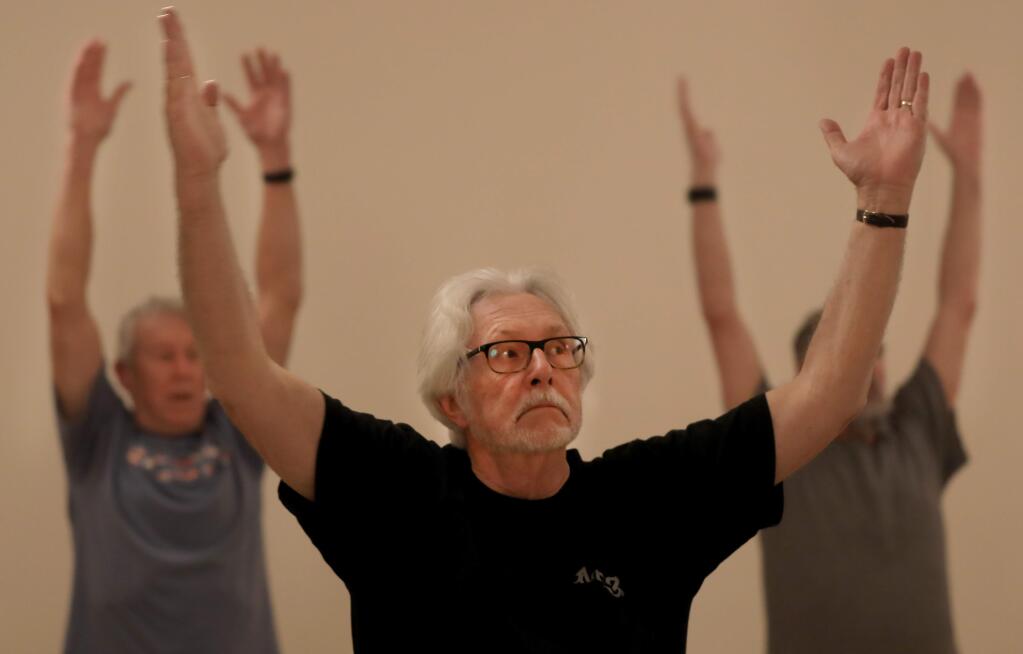 Thomas King of Cloverdale participates in the inflexible man yoga class, Tuesday, Jan. 8, 2019 in Cloverdale. (Kent Porter / The Press Democrat) 2019