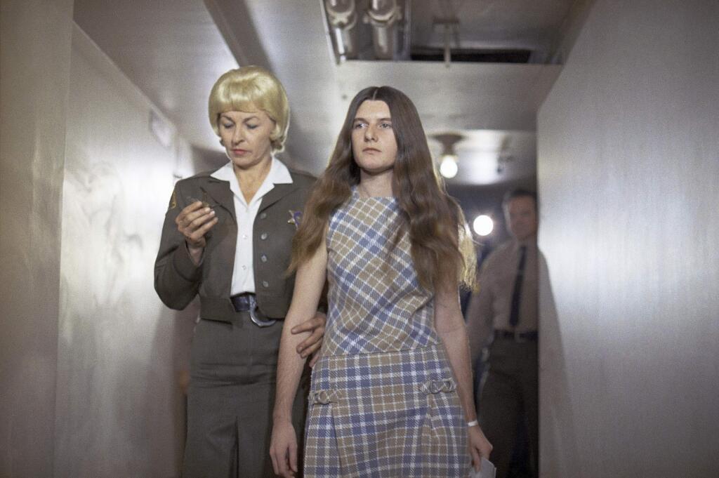 FILE - In this Feb. 24, 1970 file photo, Patricia Krenwinkel, a defendant in the Tate murder case, enters the superior court in Los Angeles for an arraignment. Krenwinkel, a follower of cult killer Charles Manson, is again seeking parole Thursday 22, 2017. (AP Photo/George Brich, File)