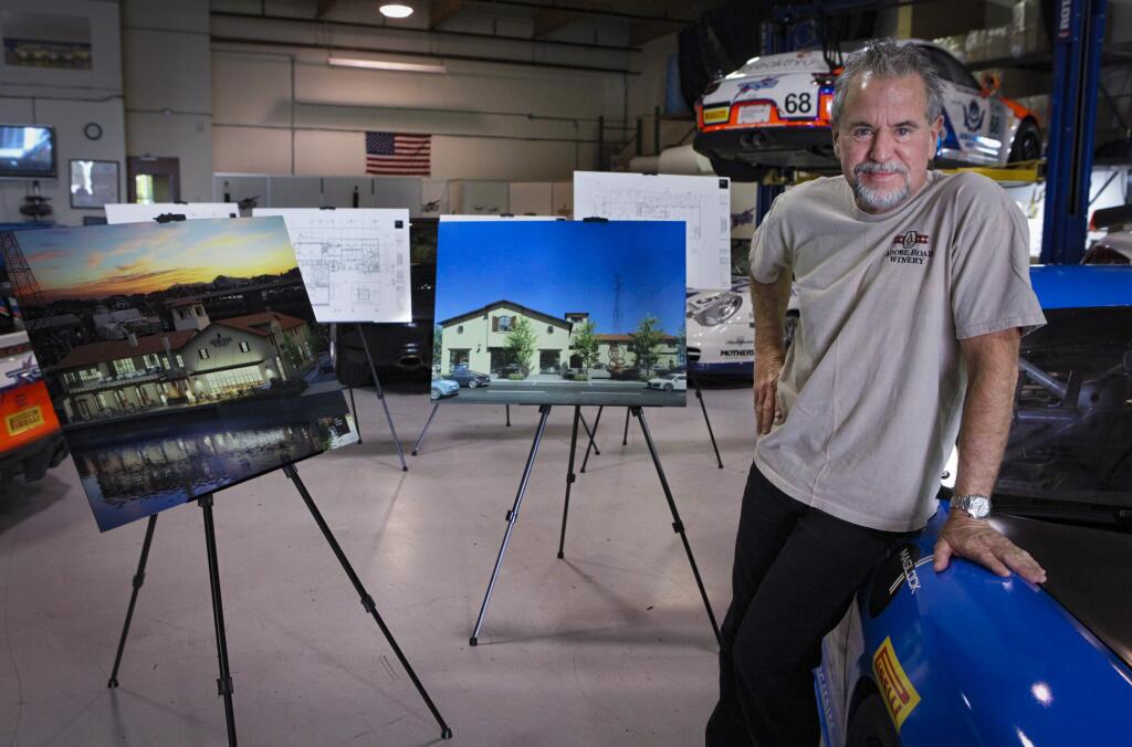 Petaluma, CA, USA. Tuesday, November 19, 2019._Kevin Buckler poses in the garage of the Adobe Winery offices where his race cars are stored and worked on. The winery is proceeding with construction on C and First Streets in downtown Petaluma, as seen in the photo renderings. (CRISSY PASCUAL/ARGUS-COURIER STAFF)