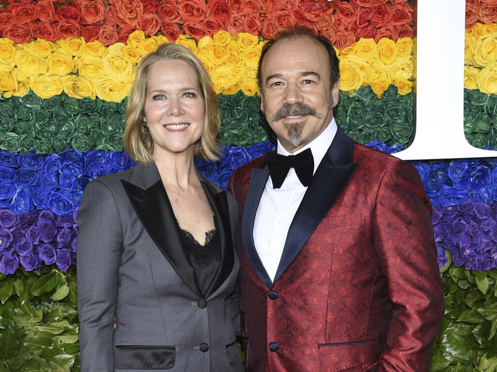 FILE - Rebecca Luker, left, and her husband Danny Burstein arrive at the 73rd annual Tony Awards in New York on June 9, 2019. Luker, 59, a three-time Tony nominated actor who starred in some of the biggest Broadway hits of the past three decades, died Wednesday, Dec. 23, 2020, said Sarah Fargo, her agent. The actor went public in 2020 saying he had been diagnosed with amyotrophic lateral sclerosis, known as A.L.S. or Lou Gehrig’s disease. (Photo by Evan Agostini/Invision/AP, File)