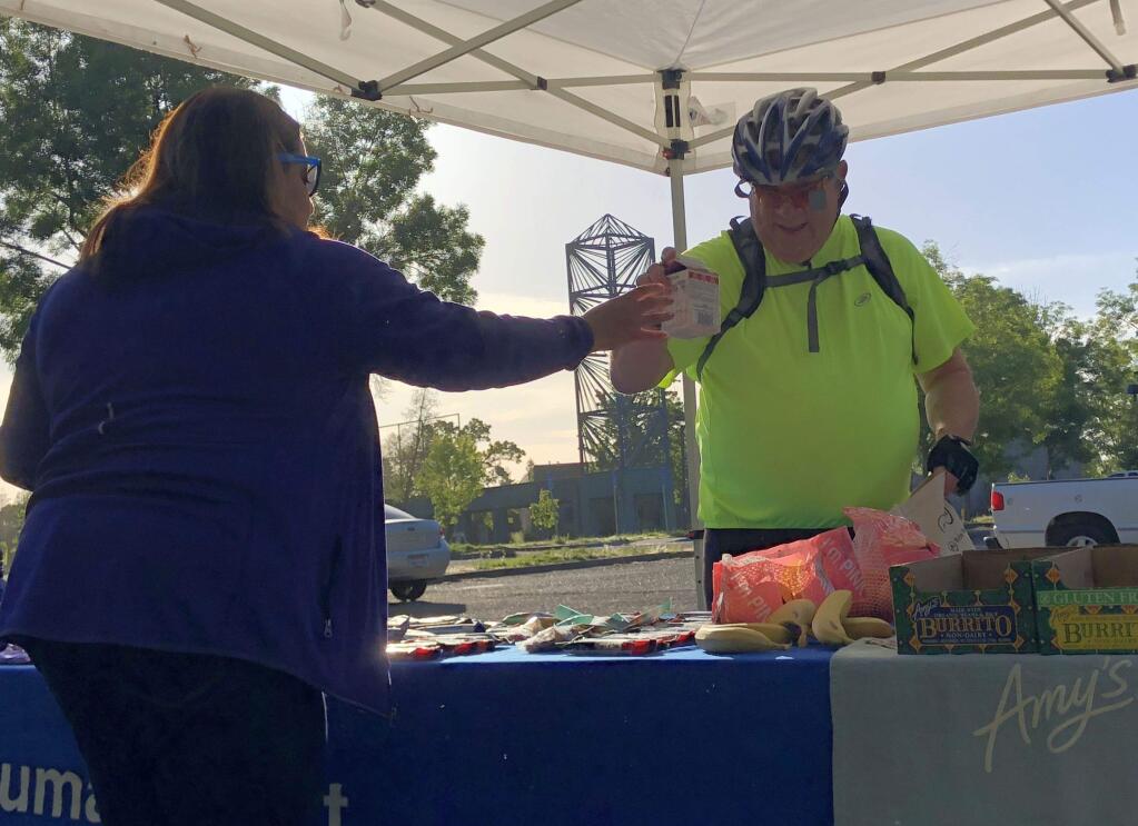 Santa Rosa's Guy Porter stopped by the Lucchesi Park energizer station on Thursday, May 10, for Bike to Work Day, a regional initiative encouraging citizens to commute to work on bicycles. YOUSEF BAIG/ARGUS-COURIER STAFF