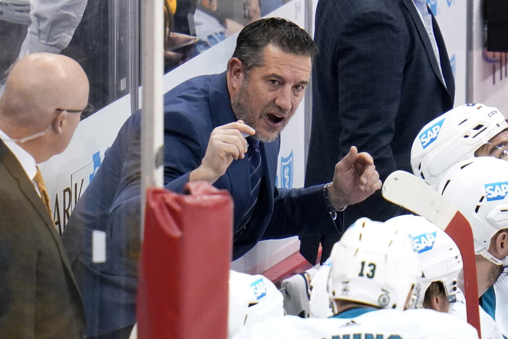 San Jose Sharks head coach Bob Boughner gives instructions during the first period of an NHL hockey game against the Pittsburgh Penguins in Pittsburgh, Sunday, Jan. 2, 2022. (AP Photo/Gene J. Puskar)