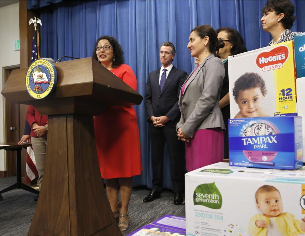 Assemblywoman Cristina Garcia, D-Bell Gardens, left, discusses the proposal by Gov. Gavin Newsom, second from left, to eliminate the state sales tax on tampons and diapers in his upcoming state budget during a news conference,Tuesday, May 7, 2019, in Sacramento, Calif. The tax cuts are part of a 'parents' agenda' Newsom is pursuing, that he plans to unveil in his revised state budget later this week. Others in support of Newsom's plan is Democratic Assembly members Monique Limon, third from left, Lorena Gonzalez, fourth from left, and state Sen. Connie Leyva, right.(AP Photo/Rich Pedroncelli)
