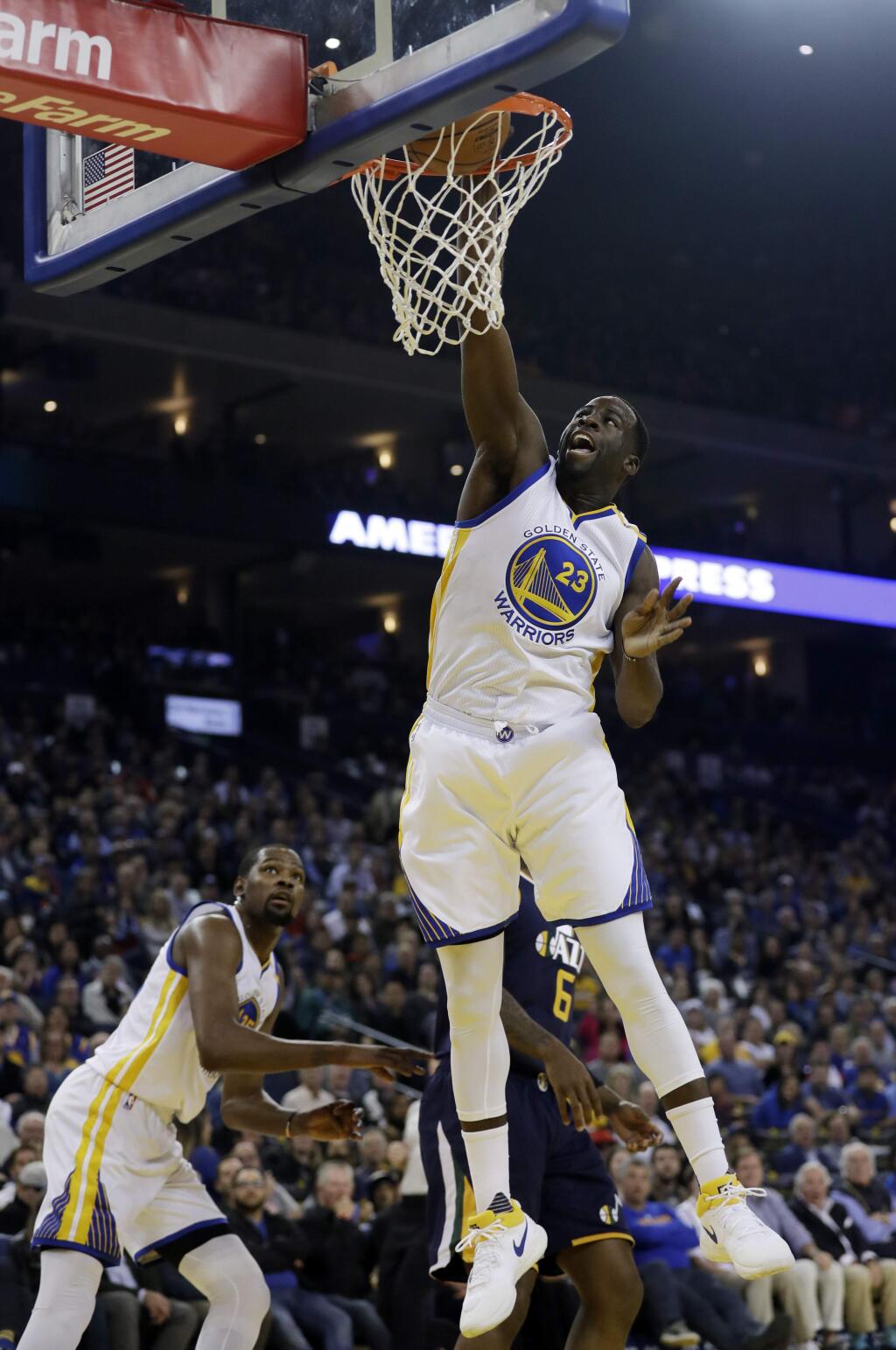 Golden State Warriors forward Draymond Green (23) dunks against the Utah Jazz during the first half of an NBA basketball game Monday, April 10, 2017, in Oakland, Calif. (AP Photo/Marcio Jose Sanchez)