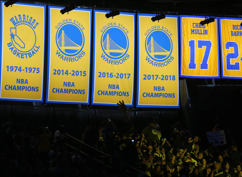 The 2017-18 NBA Championship banner is unveiled by the Golden State Warriors in Oakland on Tuesday, October 16, 2018. (Christopher Chung/ The Press Democrat)