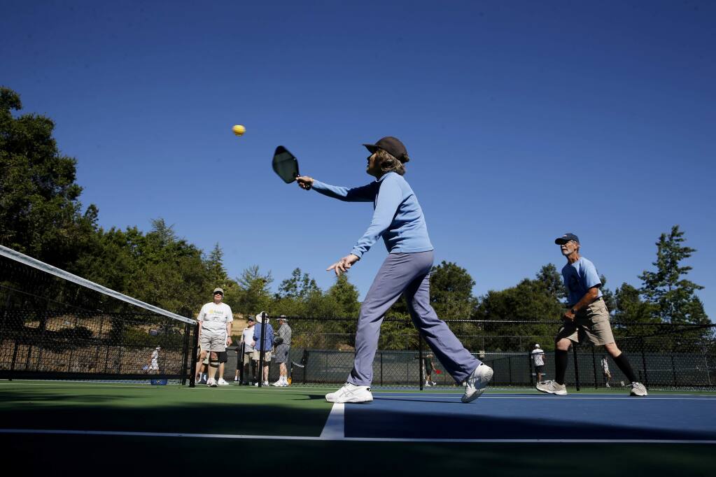 Marcia Babb and her partner Gary Bunas play pickleball on the new courts at the Oakmont East Recreation Center on Tuesday, June 12, 2018 in Santa Rosa, California . (BETH SCHLANKER/The Press Democrat)