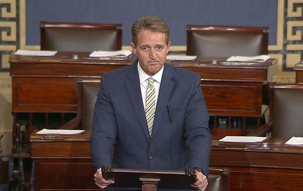 In this image from video from Senate Television, Sen. Jeff Flake, R-Ariz. speaks on the Senate floor, Wednesday, Jan. 17, 2017 at the Capitol in Washington. IFlake called Trump's repeated attacks on the media “shameful” and “repulsive” and said Trump “has it precisely backward.'' Flake said despotism is the enemy of the people, while a free press is the despot's enemy and a guardian of democracy. (Senate TV via AP)