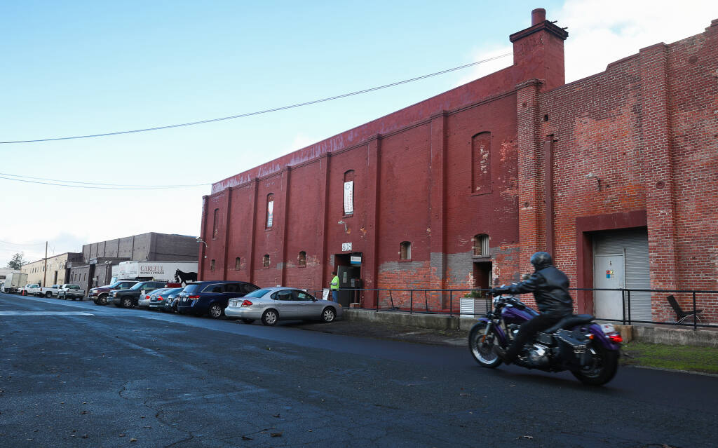 The DeTurk Winery Village project would transform the block of warehouses across from the DeTurk Round Barn into new homes reserved for low-income renters.  (Christopher Chung/ The Press Democrat)