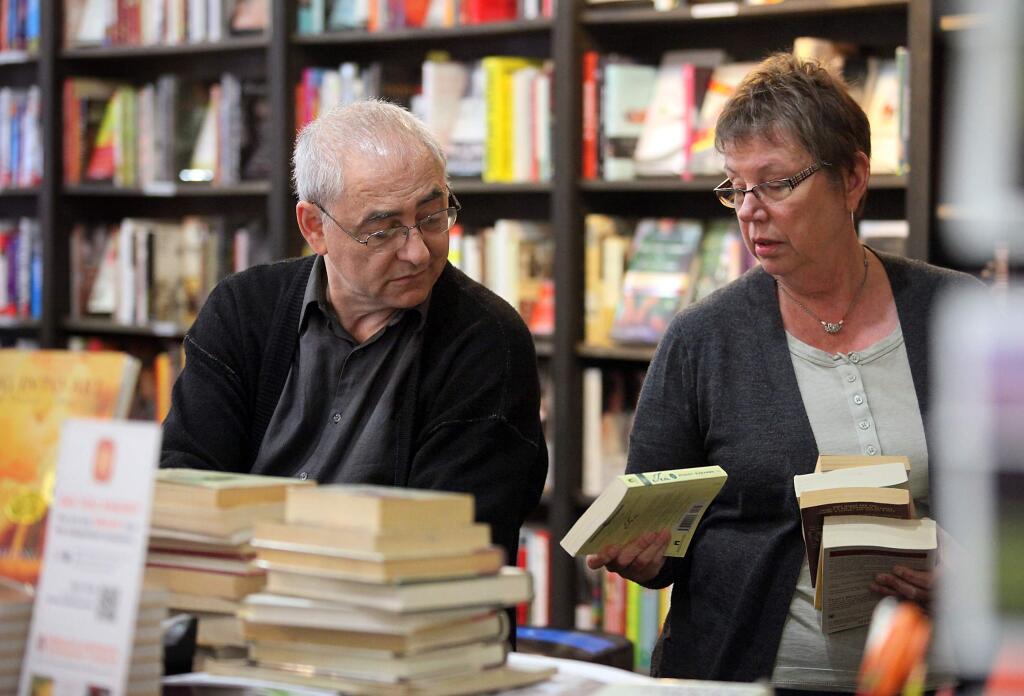 Jude Sales, right with Readers' Books owner Andy Weinberger at Readers' Books.