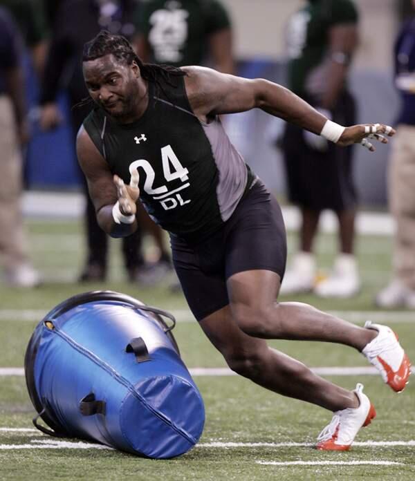 Louisiana State defensive lineman Tyson Jackson runs a football drill at the NFL scouting combine in Indianapolis, Monday, Feb. 23, 2009. (AP Photo/Michael Conroy)
