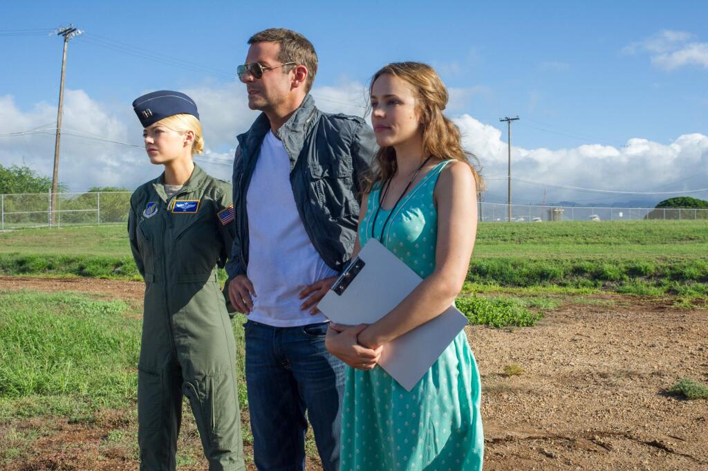 This photo provided by Sony Pictures Entertainment shows, from left, Emma Stone, Bradley Cooper, and Rachel McAdams, in a scene from Columbia Pictures' 'Aloha.' The movie releases in U.S. theaters on May 29, 2015. (Neal Preston/Sony Pictures Entertainment via AP)