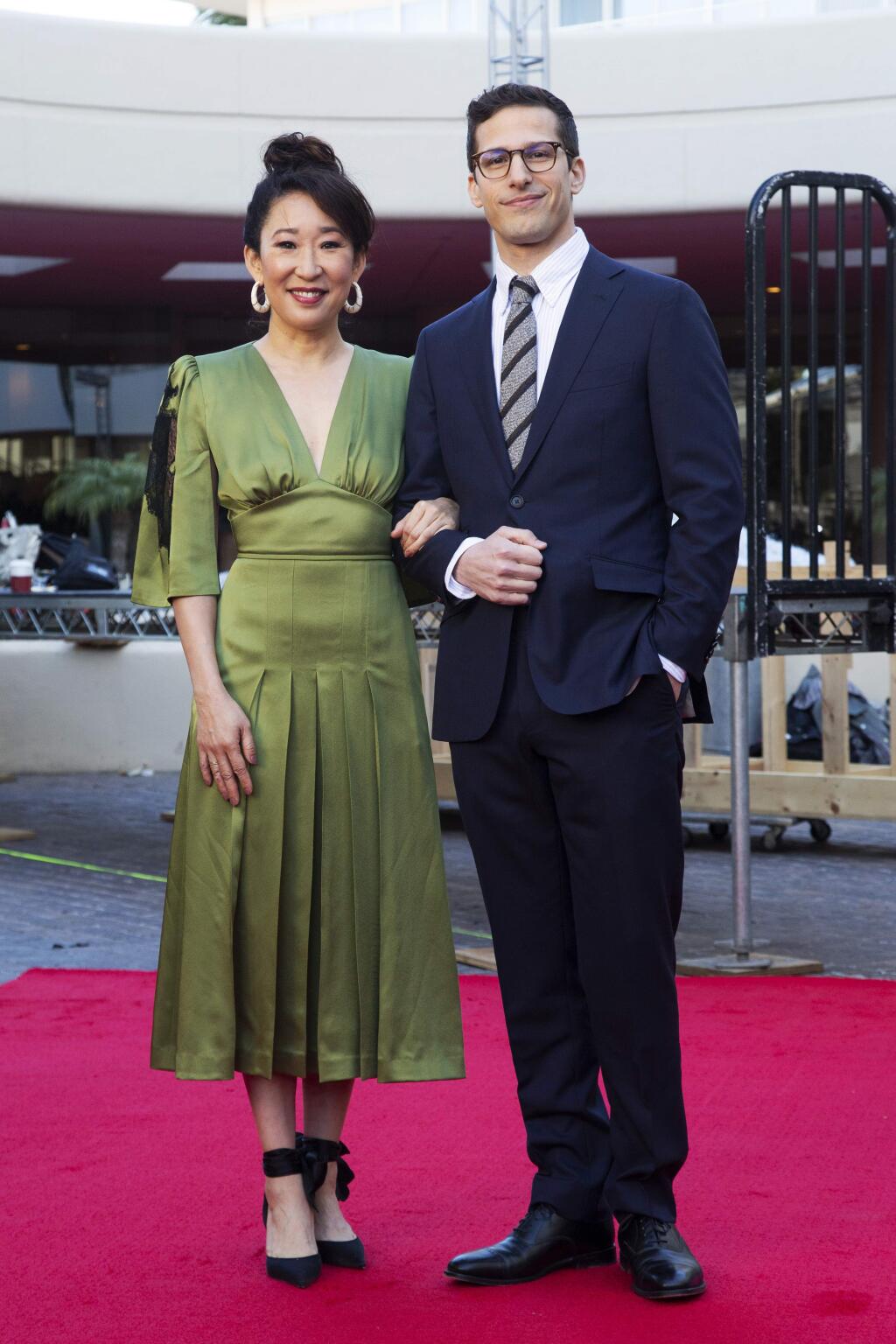 Sandra Oh, left, and Andy Samberg pose for photos on the red carpet at the 76th Annual Golden Globe Awards Preview Day at The Beverly Hilton on Thursday, Jan. 3, 2019, in Beverly Hills, Calif. (Photo by Willy Sanjuan/Invision/AP)