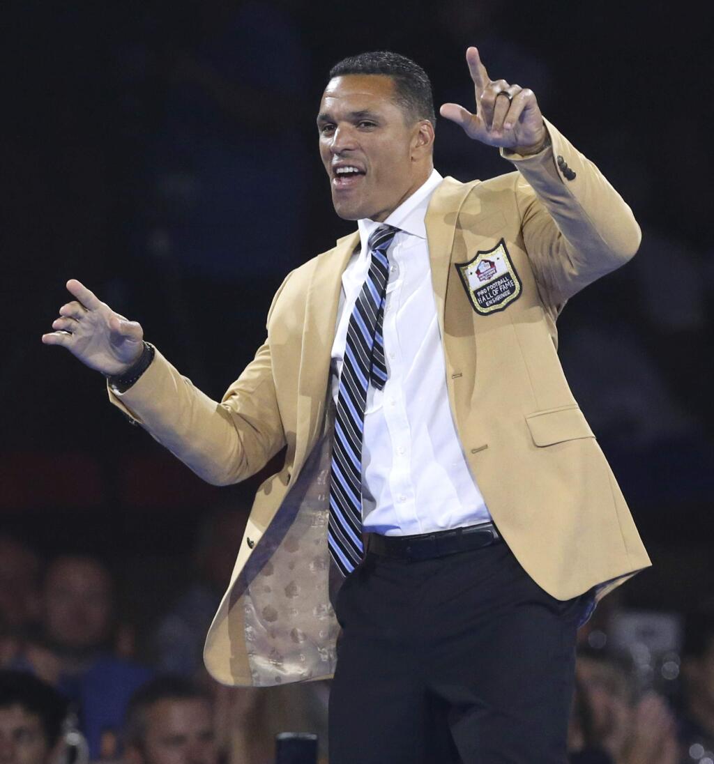 Tony Gonzalez, a member of the Pro Football Hall of Fame Class of 2019, waves to the crowd during the gold jacket dinner in Canton, Ohio, Friday, Aug. 2, 2019. (Scott Heckel/The Canton Repository via AP)