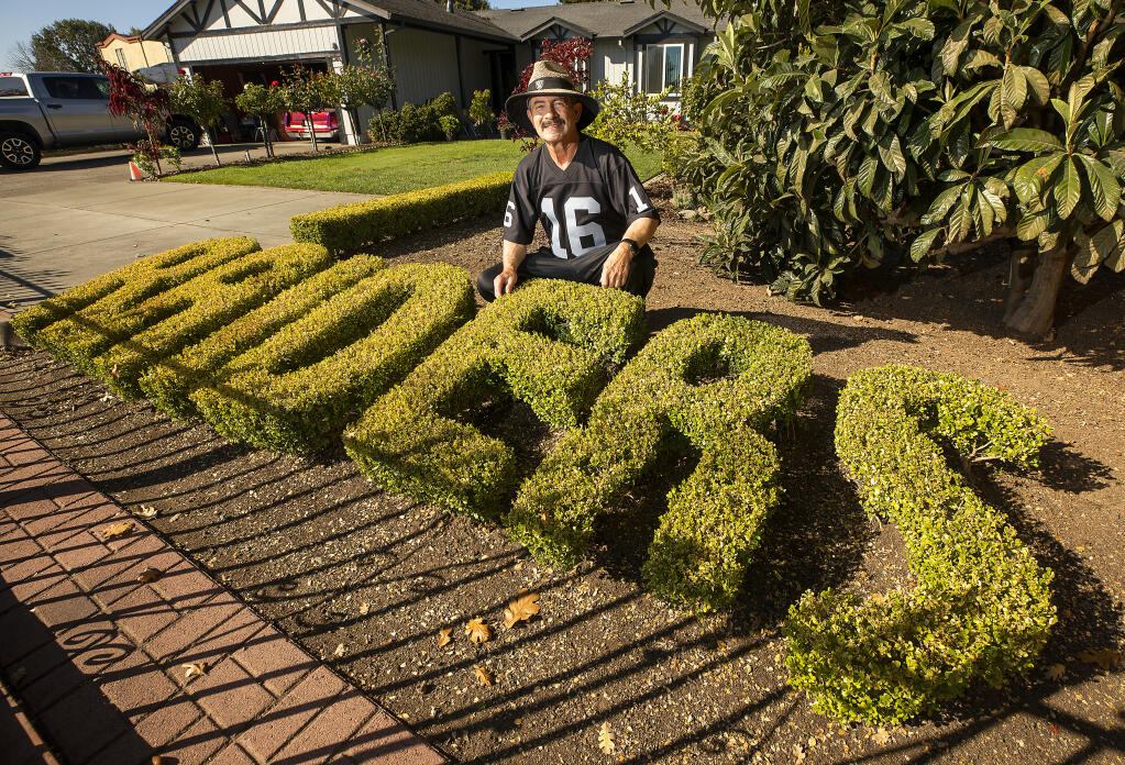 Antonio Mendoza, 73, a retired groundskeeper for Roseland School District, spent two years growing a hedge in his Roseland area front yard so he could trim it to spell "Raiders" in the front yard of his silver and black home. Photo taken Tuesday, Sept. 28, 2021.  (John Burgess/The Press Democrat)