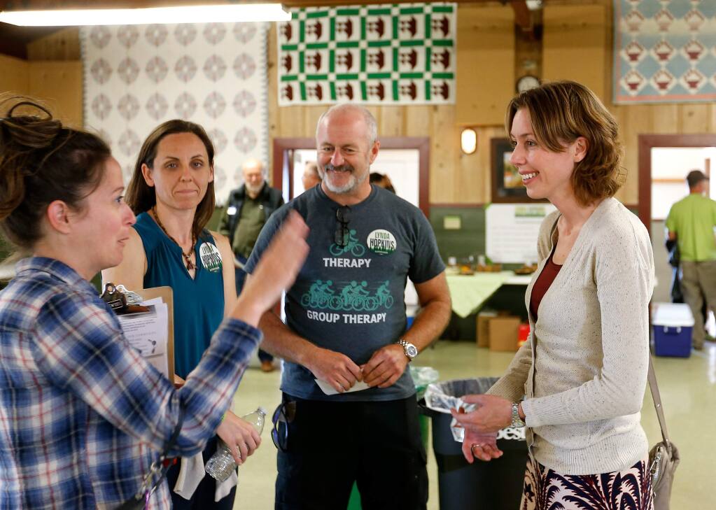 Sonoma County fifth district supervisor candidate Lynda Hopkins, right, talks with Diana Andree, left, Kate Jonasse, and Billy Coughlan before holding a town hall meeting at Sebastopol Grange, in Sebastopol, California on Wednesday, September 14, 2016. (Alvin Jornada / The Press Democrat)