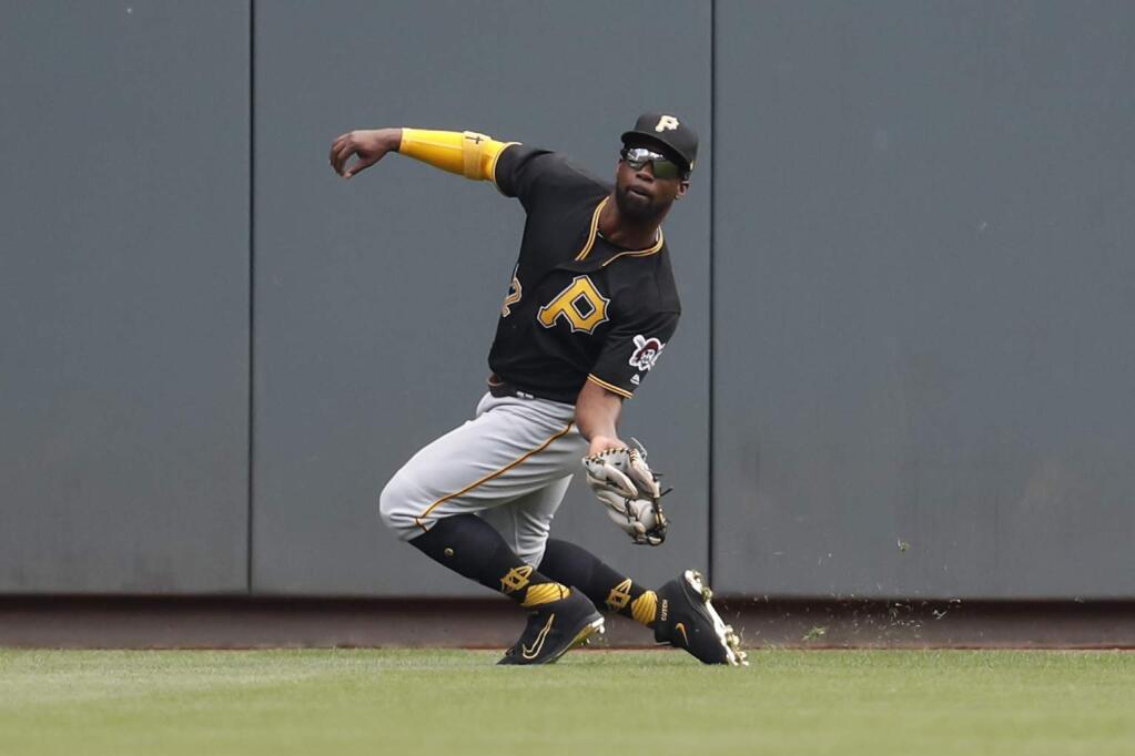 In this Sept. 16, 2017, file photo, Pittsburgh Pirates center fielder Andrew McCutchen catches hit for an out by the Cincinnati Reds' Jesse Winker during a game in Cincinnati. (AP Photo/John Minchillo)