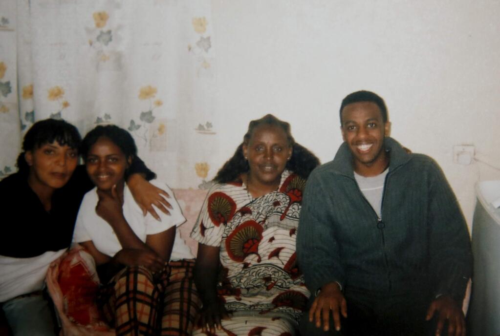 Cirak Mateos Tesfazgi, right, who was stabbed to death early Monday, seen in a 2008 photo during a trip to Eritrea.(Photo courtesy of the Tesfazgi family)