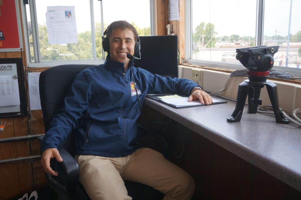 Rylan Kobre sits in the press box where he does the play-by-play broadcasts for the Kenosha Kingfish, a Northwoods League summer baseball team.