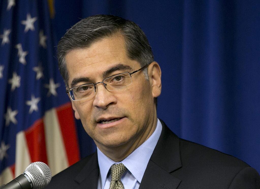 FILE - In this Jan. 24, 2018, file photo California Attorney General Xavier Becerra talks during a news conference in Sacramento, Calif. Becerra filed criminal charges against five people accused of misusing funds at a rural water agency on Wednesday, Feb. 21, 2018. The felony charges range from conspiracy to misappropriate public funds to unlawful disposal of hazardous waste. The investigation alleges the five used public funds for things including housing, baseball games, and a Katy Perry concert. The prosecution follows a 2017 state audit report on the Panoche Water District in Central California's farm hub. (AP Photo/Rich Pedroncelli, File)