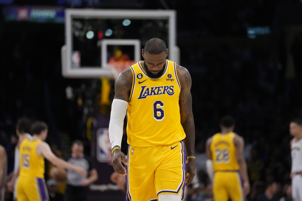 Lakers forward LeBron James looks down in the closing minutes of Monday’s loss to the Denver Nuggets in the second half of Game 4 of the NBA Western Conference finals in Los Angeles. (Ashley Landis / ASSOCIATED PRESS)