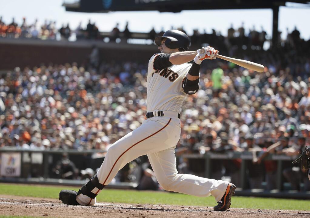 San Francisco Giants' Buster Posey hits a two-RBI double off Arizona Diamondbacks starting pitcher Shelby Miller in the first inning Wednesday, Aug. 31, 2016, in San Francisco. (AP Photo/Eric Risberg)