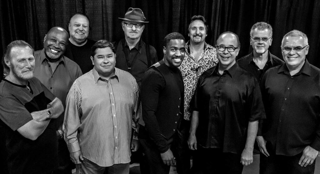This Aug. 2016 photo provided by courtesy of Tower of Power/Webster Public Relations, shows the band members from Tower of Power, from left, Rocco Prestia, Roger Smith, Sal Cracchiolo, Adolfo Acosta, Stephen 'Doc' Kupka, Marcus Scott, Tom E. Politzer, Emilio Castillo, David Garibaldi, and Jerry Cortez. Two members of Tower of Power, a group that has been an R&B institution for nearly 50 years, were hit by a train Thursday night, Jan. 12, 2017, as they walked across tracks before a scheduled gig in their hometown of Oakland, Calif., but both survived, their manager said. Calling it an 'unfortunate accident,' manager Jeremy Westby said in a statement that drummer Garibaldi and bass player Marc van Wageningen (not pictured) are 'responsive and being treated at a local hospital.' (Tower of Power/Webster Public Relations via AP)