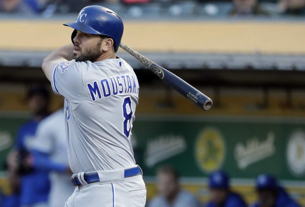 Kansas City Royals' Mike Moustakas watches a double during the first inning of the team's baseball game against the Oakland Athletics pm Thursday, June 7, 2018, in Oakland, Calif. (AP Photo/Marcio Jose Sanchez)