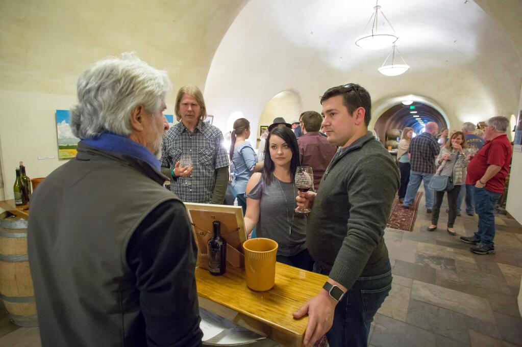 Guests gather for tastings at Deerfield Ranch Winery during  the Savor Sonoma Valley event in 2017. Seventeen area wineries participated in the barrel tasting event, an example of the larger regional winery events that many would like to see limited. (Jeremy Portje / For The Press Democrat)