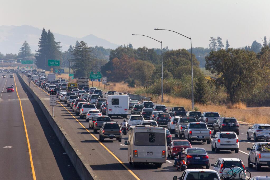 Traffic is backed up heading South on Highway 101 during mandatory evacuations due to predicted danger from the Kincade Fire, in Windsor, Calif., on Saturday, October 25, 2019. (Photo by Darryl Bush / For The Press Democrat)