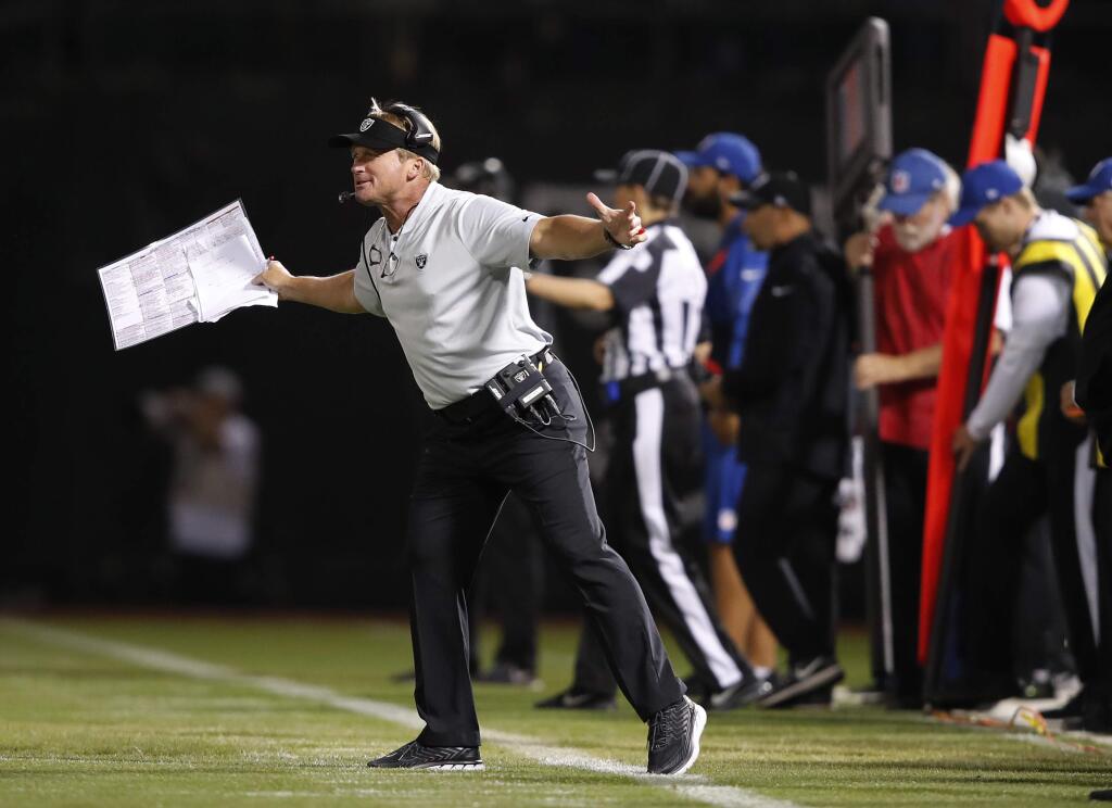 Oakland Raiders head coach Jon Gruden gestures on the sidelines during the second half of an NFL football game against the Los Angeles Rams in Oakland, Calif., Monday, Sept. 10, 2018. (AP Photo/John Hefti)