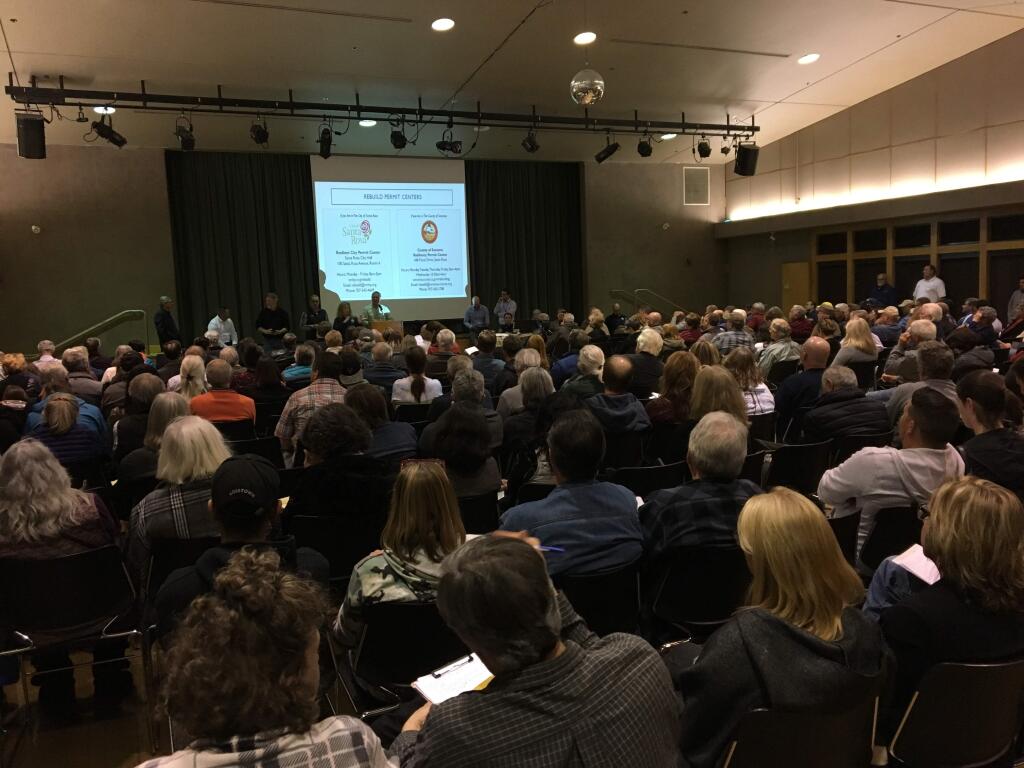 Nearly 300 people attended a town hall meeting at the Finley Community Center in Santa Rosa on Thursday, Feb. 15, 2018 to better understand what steps need to be taken before they can break ground on a new home. (NICK RAHAIM/PRESS DEMOCRAT)