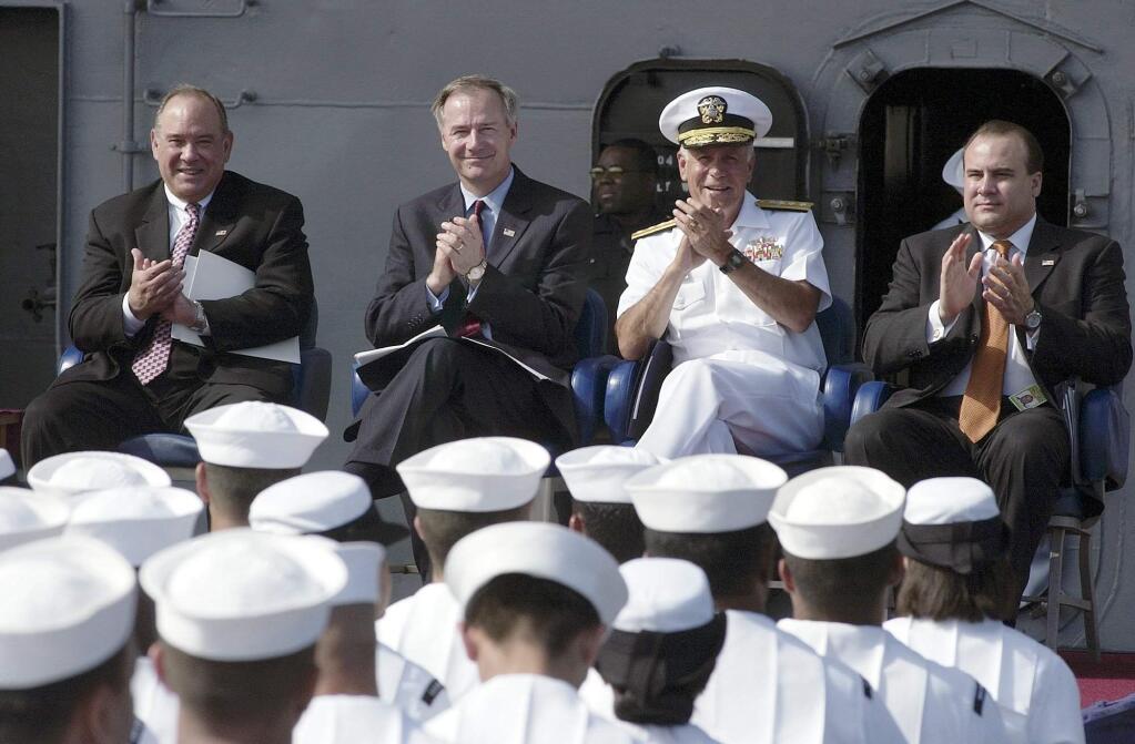 Rear Adm. Jose Betancourt, Jr. and other dignitaries preside over a naturalization ceremony on the deck of the USS Constellation in 2003. (TIM TADDER / Associated Press)