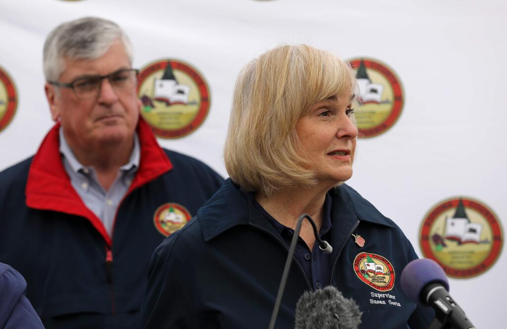 Sonoma County Board of Supervisors Chair Susan Gorin speaks while Supervisor David Rabbitt stands behind her during a press conference on Sunday, March 15, 2020, about the first community spread case of the coronavirus and the local response. (Beth Schlanker / The Press Democrat)