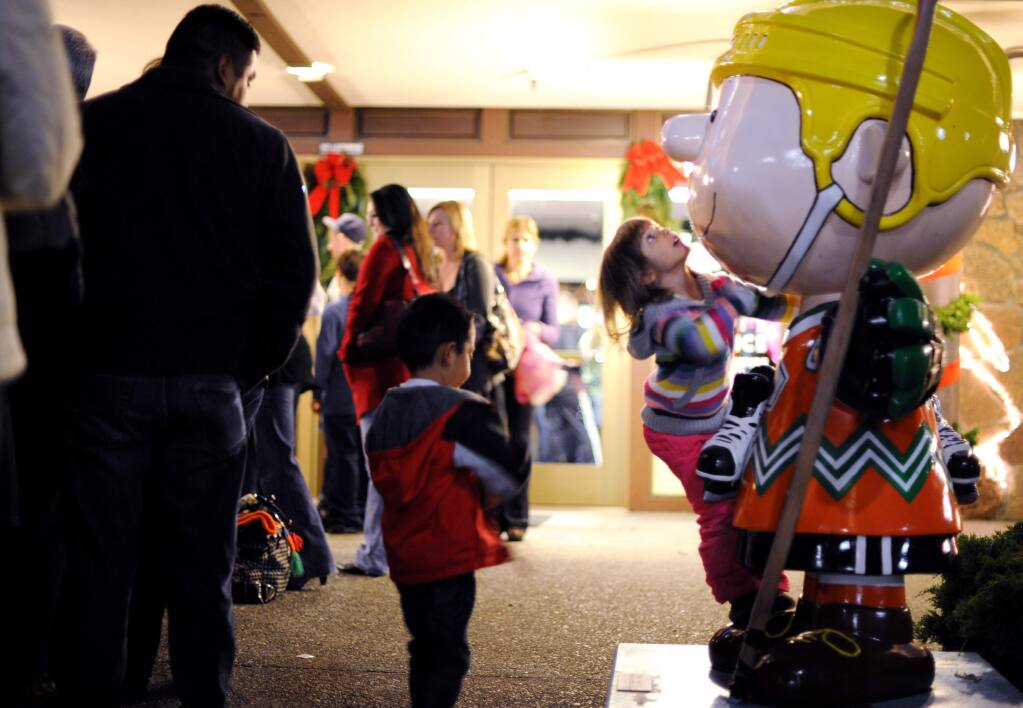 Annalise Hunter, 4, of San Rafael, California gets an up close look at Charlie Brown while in line for the Snoopy ice show and holiday tree-lighting event held Friday evening at the Redwood Empire Ice Arena in Santa Rosa. December 2, 2011 (Photo: Erik Castro/for The Press Democrat)