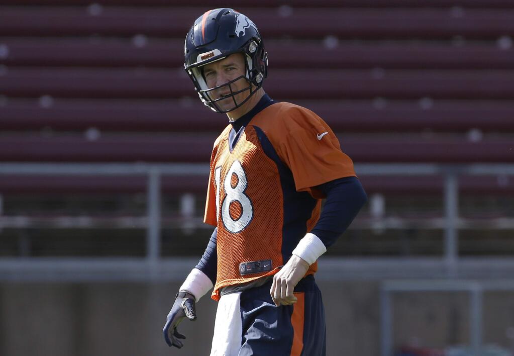 Denver Broncos quarterback Peyton Manning (18) stands on the field during an NFL football practice in Stanford, Calif., Thursday, Feb. 4, 2016. (AP Photo/Jeff Chiu)