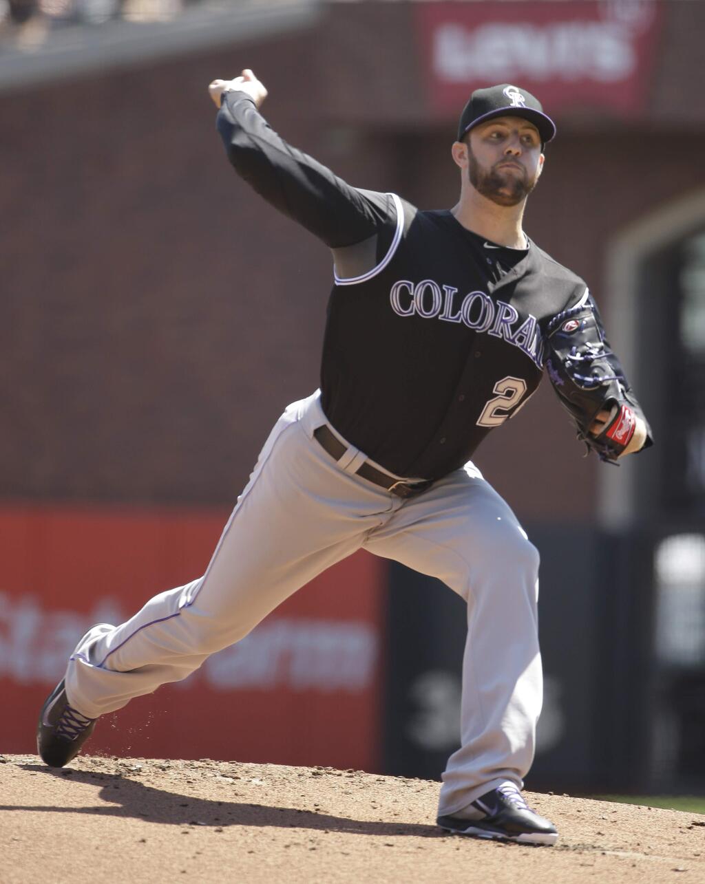 Colorado Rockies starting pitcher Jordan Lyles throws against the San Francisco Giants in the first inning of their game Thursday, Aug. 28, 2014, in San Francisco. (AP Photo/Eric Risberg)