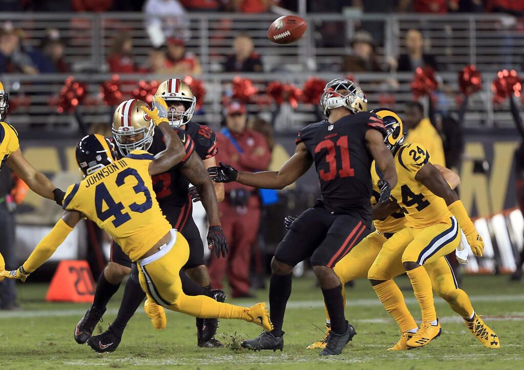 Raheem Mostert recovers an onside kick to give the 49ers hope in the final minutes of their 41-39 loss to the Rams, Thursday Sept. 21, 2017 at Levi's Stadium in Santa Clara. (Kent Porter / The Press Democrat) 2017